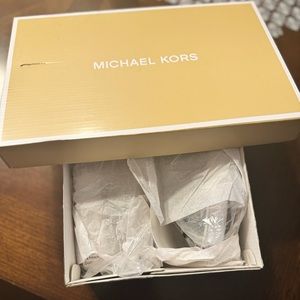 Women size 10 brand new metallic Michael Kors slip on sneakers